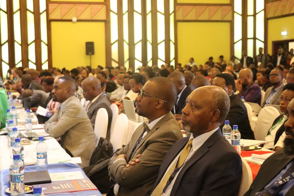 An audience at the 2023 KEMRI KASH Conference listens to a presenter.